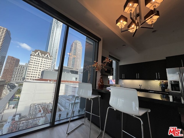 kitchen with stainless steel fridge with ice dispenser