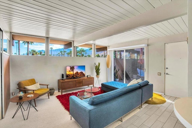 sunroom featuring beamed ceiling