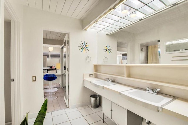 bathroom with vanity and tile patterned floors