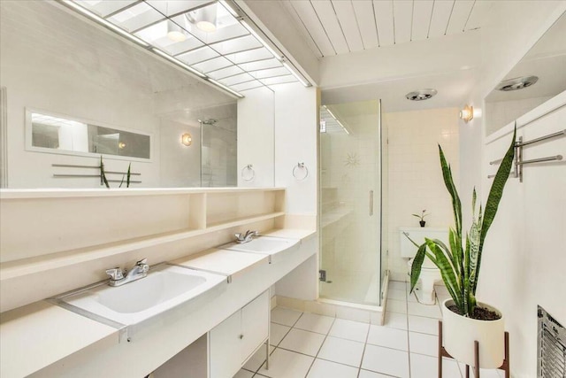 bathroom with vanity, tile patterned floors, and an enclosed shower