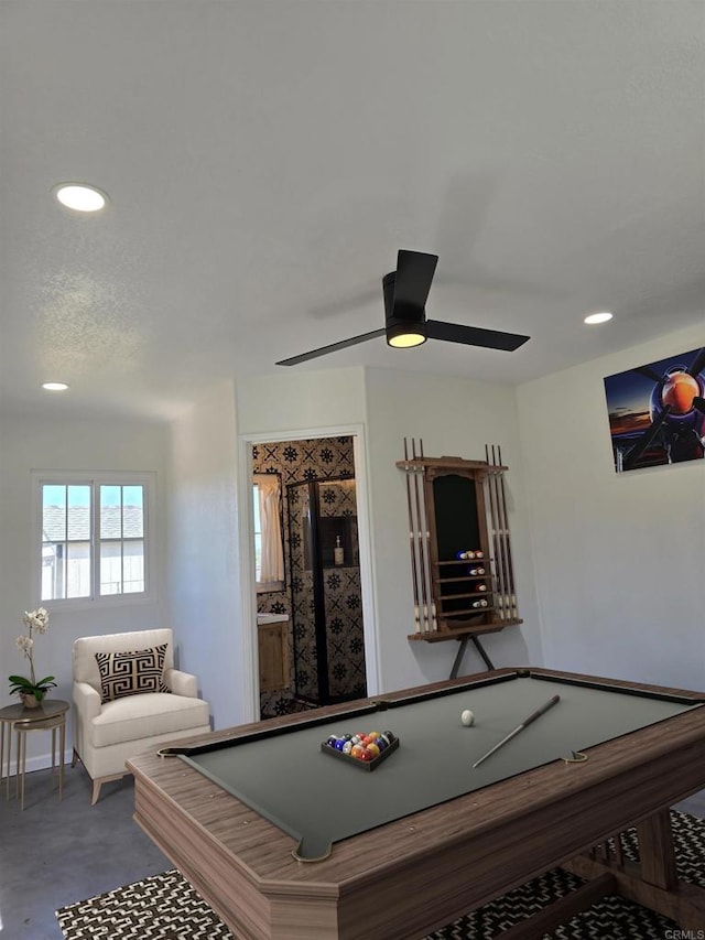 game room featuring ceiling fan, concrete flooring, and billiards