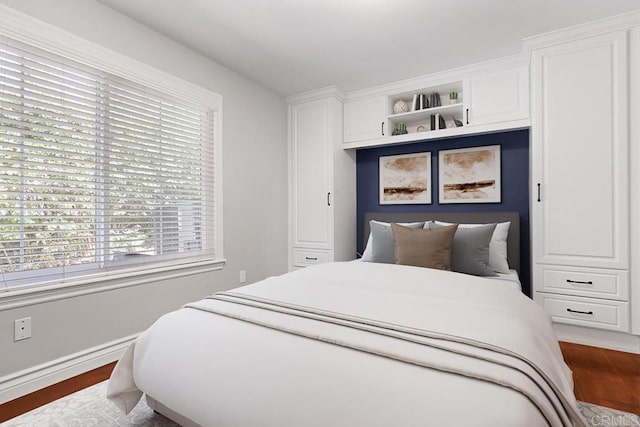 bedroom with hardwood / wood-style floors