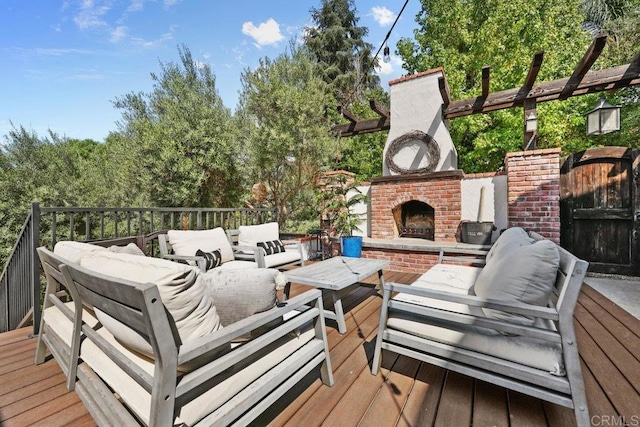 deck featuring an outdoor living space with a fireplace