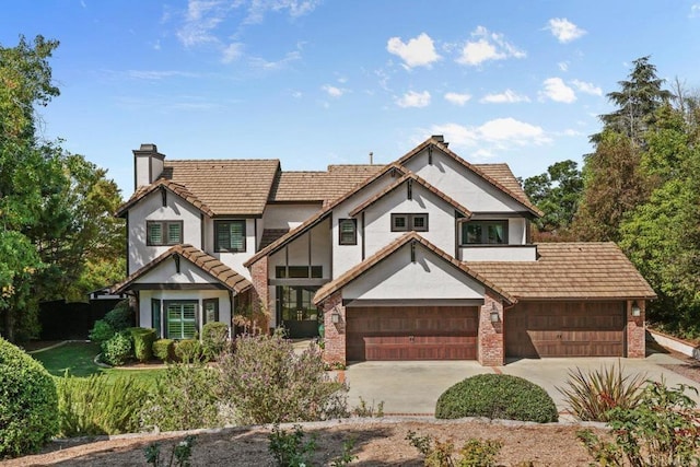 tudor-style house with a garage