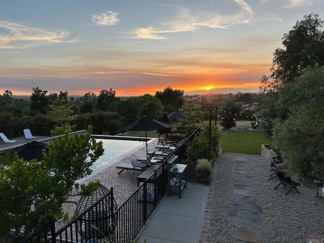 view of patio terrace at dusk