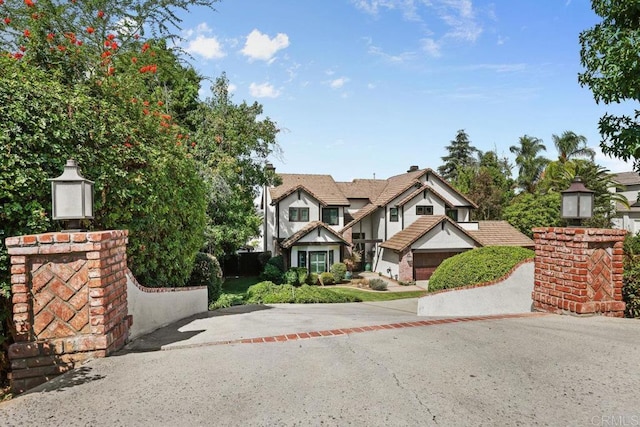 english style home with a garage