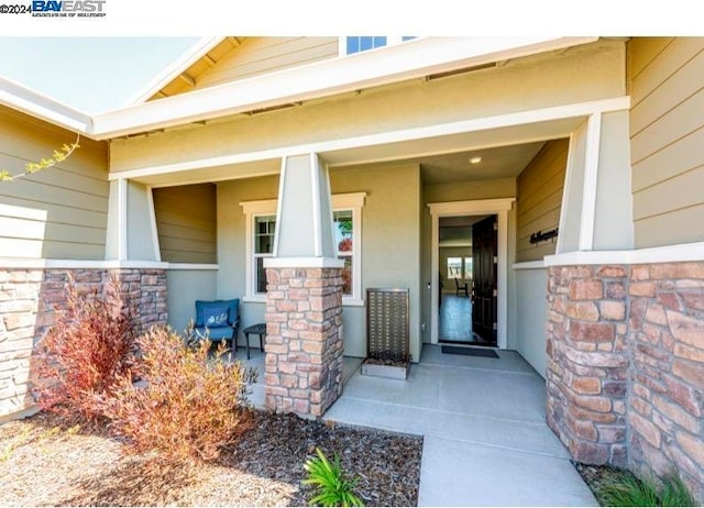 property entrance featuring a porch