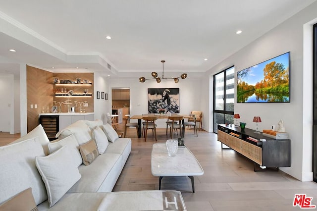 living room with beverage cooler and light hardwood / wood-style floors