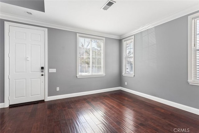 entryway with crown molding and dark hardwood / wood-style floors