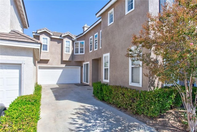 multi unit property featuring a garage