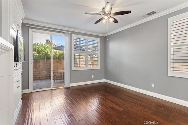 unfurnished room with ceiling fan, crown molding, and dark wood-type flooring