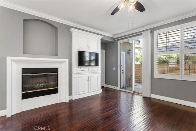 unfurnished living room featuring dark hardwood / wood-style floors, ceiling fan, and ornamental molding