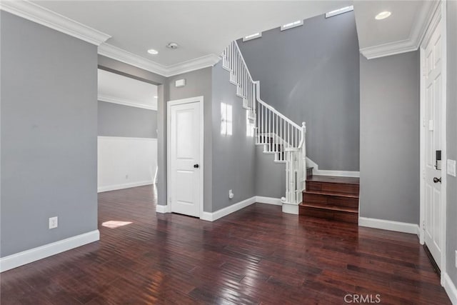 entrance foyer featuring dark hardwood / wood-style floors and ornamental molding