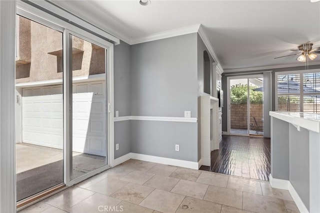 doorway featuring ceiling fan, ornamental molding, and light hardwood / wood-style flooring