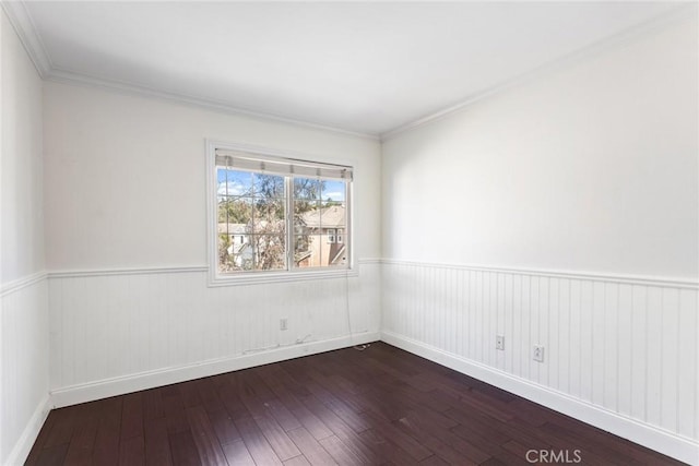 unfurnished room featuring crown molding and wood-type flooring