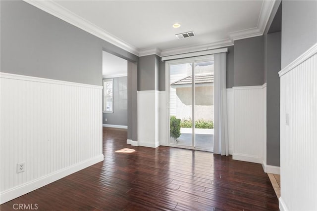 unfurnished room featuring dark hardwood / wood-style floors and crown molding