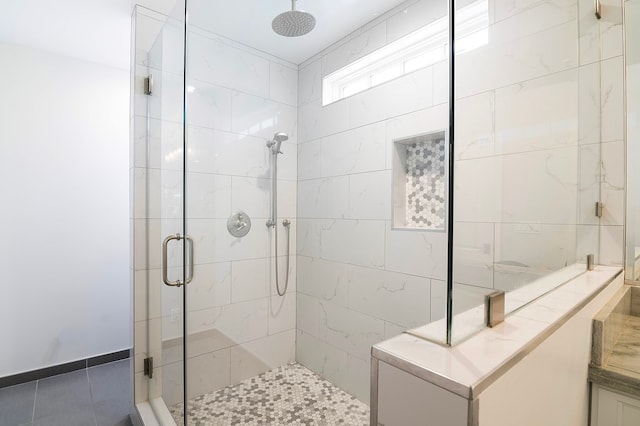 bathroom with tile patterned floors and a shower with shower door