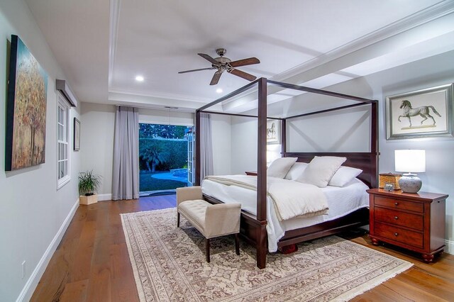 bedroom featuring ceiling fan, access to exterior, hardwood / wood-style floors, and crown molding