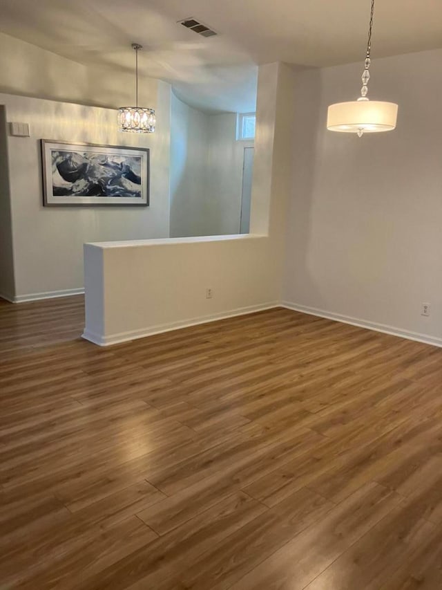 unfurnished dining area with dark hardwood / wood-style floors