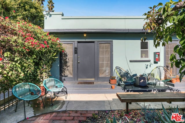 property entrance with a patio area