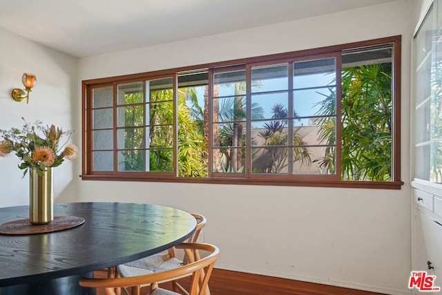 dining space with dark hardwood / wood-style floors