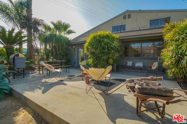 view of patio / terrace with an outdoor fire pit