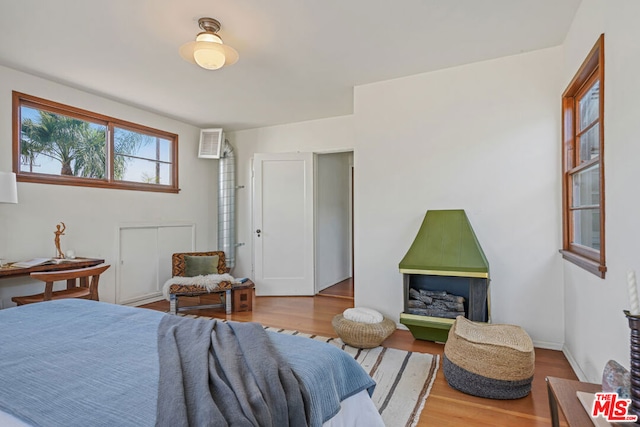 bedroom with hardwood / wood-style floors