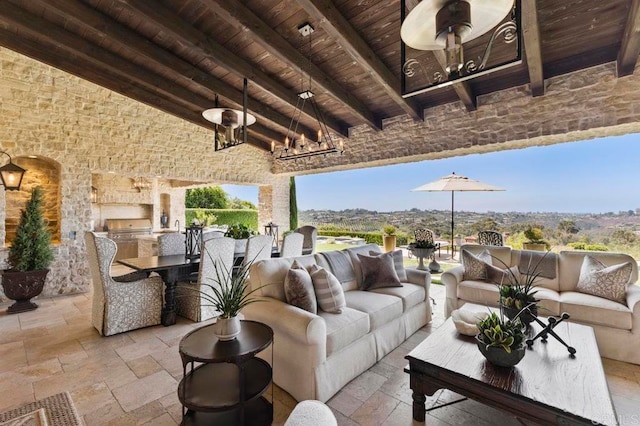 view of patio / terrace with an outdoor kitchen and outdoor lounge area