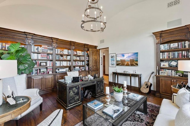 sitting room featuring an inviting chandelier, dark hardwood / wood-style flooring, and high vaulted ceiling