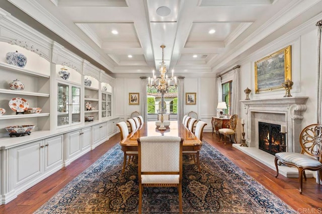 dining room featuring coffered ceiling, crown molding, and dark wood-type flooring