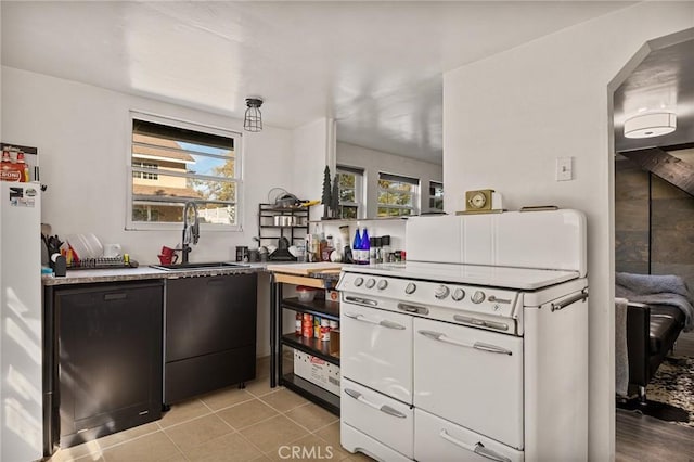 kitchen featuring sink and light tile patterned floors