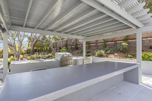 view of patio featuring sink and area for grilling