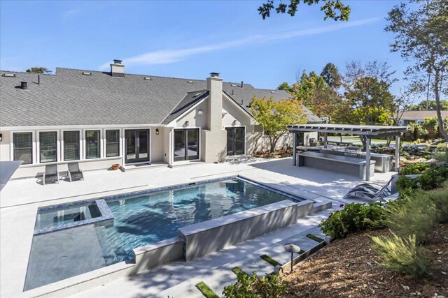 view of swimming pool featuring a pergola, a patio area, and an in ground hot tub