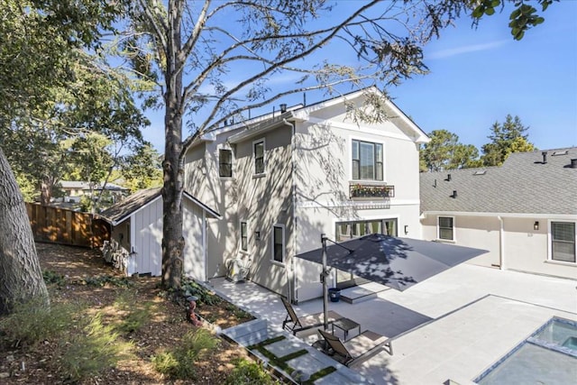 back of property featuring a patio