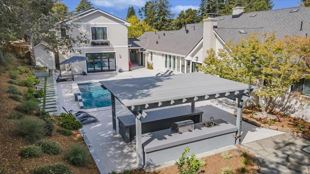 rear view of house with a patio area