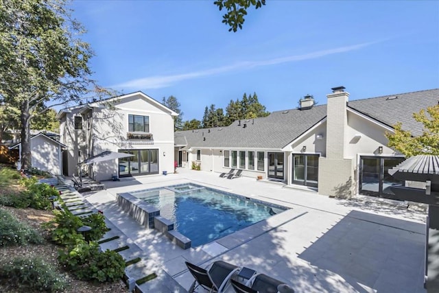 view of swimming pool featuring a patio area