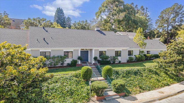 ranch-style house with a front yard