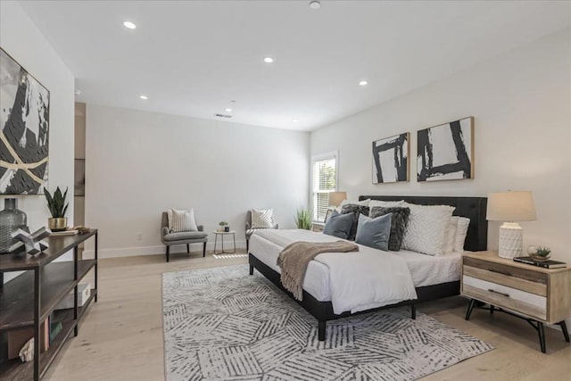 bedroom with light hardwood / wood-style floors