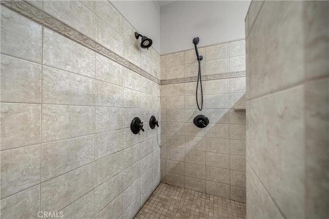 full bathroom with a tile shower