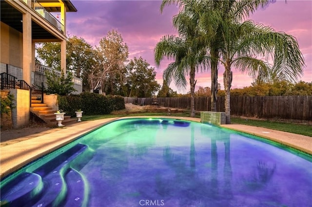 view of swimming pool featuring a fenced in pool and a fenced backyard