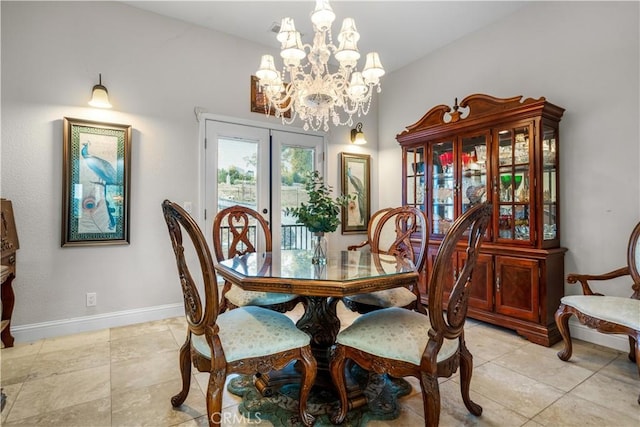 dining area with light tile patterned floors, baseboards, a notable chandelier, and french doors