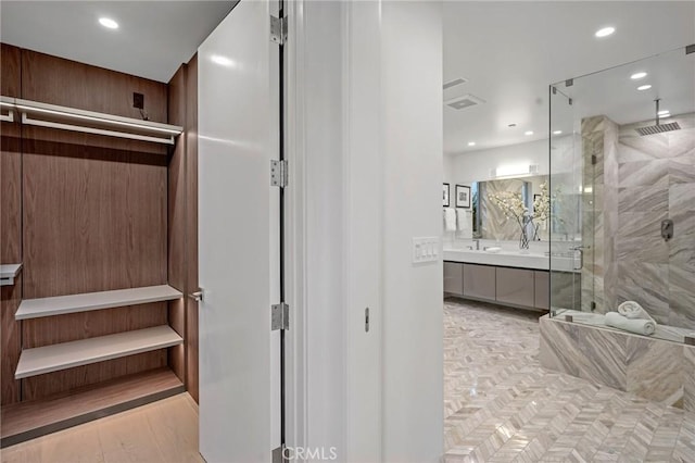 bathroom featuring vanity and walk in shower