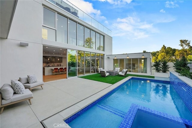 view of pool featuring a patio area and an outdoor hangout area