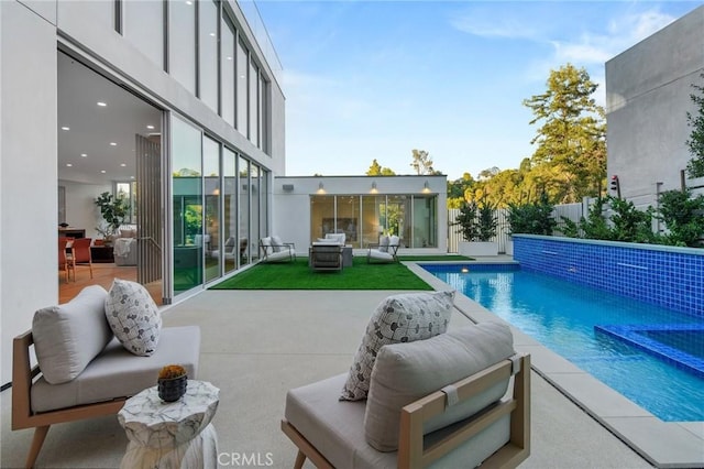 view of swimming pool with a patio area and an outdoor hangout area