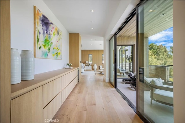 hall with light hardwood / wood-style floors