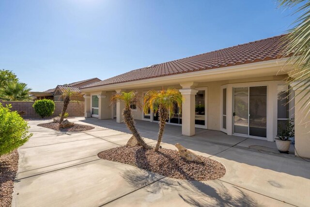 rear view of house with a patio