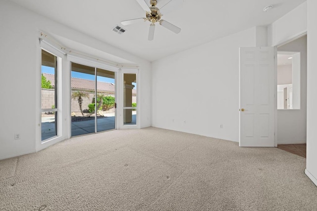 unfurnished room featuring ceiling fan and carpet floors