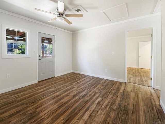 spare room with ceiling fan, dark wood-type flooring, and ornamental molding