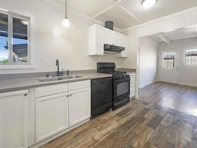 kitchen featuring pendant lighting, dark wood-type flooring, black appliances, sink, and white cabinetry