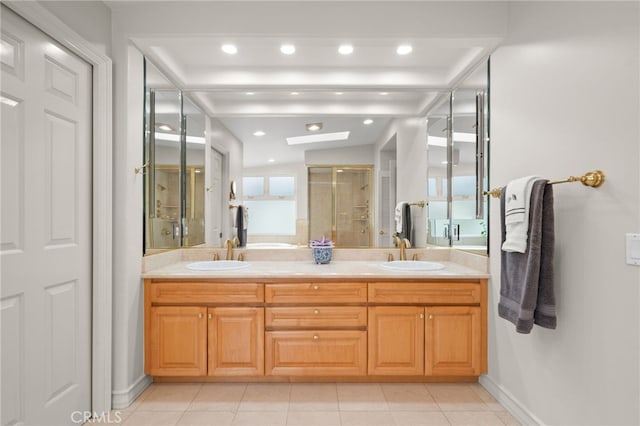 bathroom with tile patterned flooring, a shower with shower door, and vanity